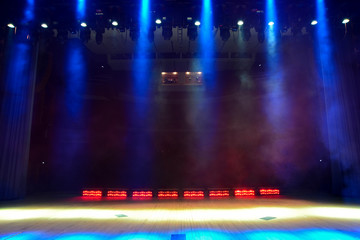 Illuminated empty concert stage with smoke - obrazy, fototapety, plakaty