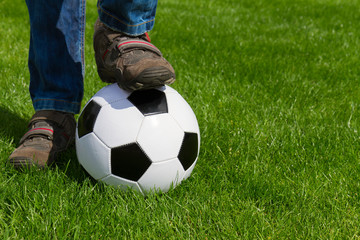 close up of foot and football ball