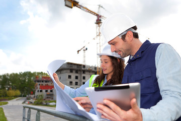 Co-workers working on a construction site