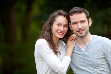 Portrait of a young happy couple in the nature