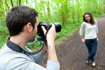 Photographer taking picture of an attractive model