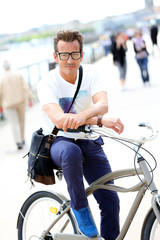Fototapeta na wymiar Man riding bicycle in Bordeaux