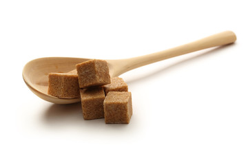 Cane sugar with wooden spoon