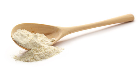 Fototapeta na wymiar White wheat flour in wooden spoon