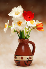 Tulips and narcissus in vase