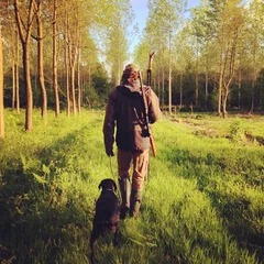 Foto op Canvas Man hunting with dog © Morgan