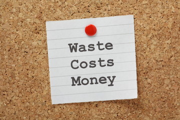 Waste Costs Money  reminder on a cork notice board