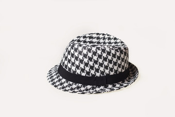 Hat with a hundstooth pattern