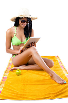 Happy young girl with green bikini and digital table