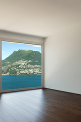 Obraz na płótnie Canvas empty room with window overlooking the lake