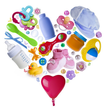 Baby accesories arranged in a heart shape