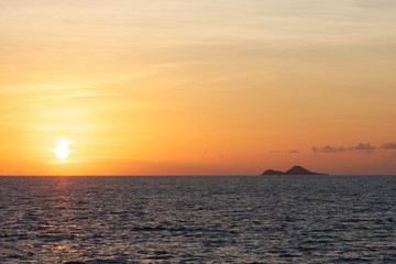 Fototapeta na wymiar Sunset over island 1
