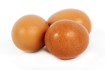 Three brown eggs
