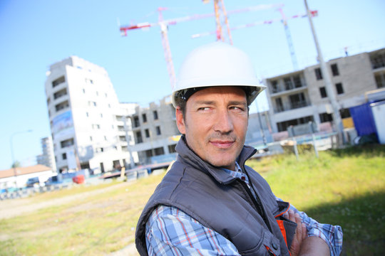 Portrait of entrepreneur on building site