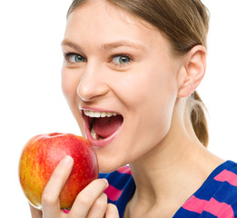 Young happy girl with apple