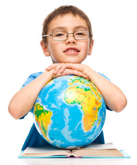 Little boy is holding globe