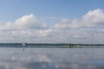 Fotobehang Sail boat on a calm lake © Tomasz Kozal