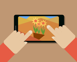 Mobile phone with picture of flowers and hands