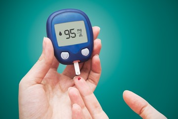 Woman doing blood sugar test