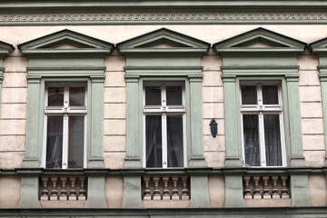 Fototapeta na wymiar Three window of green building