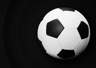 Naklejka premium Soccer ball on dark