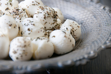 mini mozzarellas on an old fashioned plate