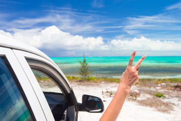 Close up raised hands at perfect beach
