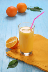Glass and jug of orange juice
