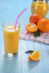 Glass and jug of orange juice