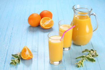 Glass and jug of orange juice
