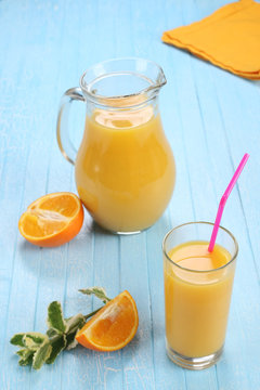 Glass and jug of orange juice