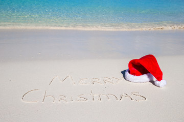 Merry Christmas written on tropical beach white sand with xmas