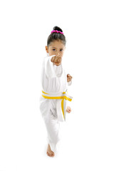 cute little girl in karate martial arts training punch attack