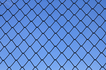 Fototapeta premium metallic net with blue sky background