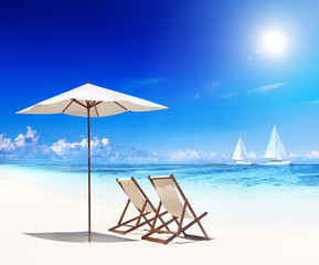 Deck Chairs on Beach with View of Sail Boats