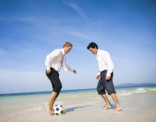 Two business men on beach
