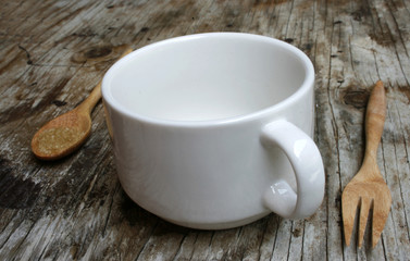 blank a white cup on wooden