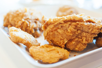 Fried chicken in window lighting .