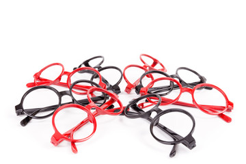 Stack of red and black glasses isolated on white