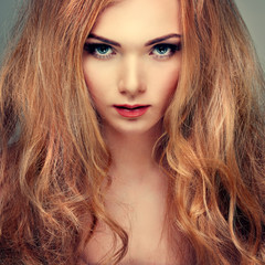 Obraz premium Beautiful girl, isolated on a light - grey, emotions, cosmetics