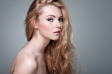 Naklejka premium Beautiful girl, isolated on a light - grey, emotions, cosmetics