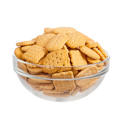 Crackers in glass bowl isolated over white