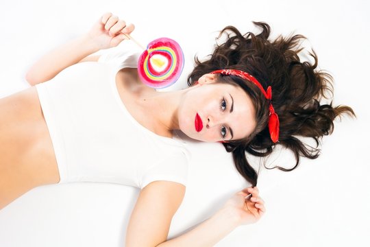 Pretty sexy pin up girl with lollipop