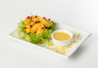 Chicken strips, lettuce and pomegranate