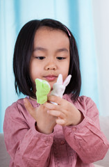 Asian girl with puppets