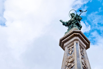 Fototapeta na wymiar Saint Dominic statue and obelisk in Naples, Italy