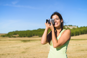 Woman on summer vacation taking photo