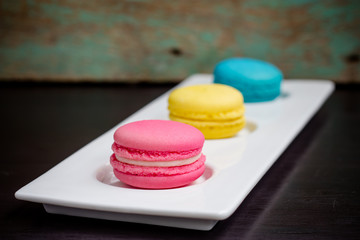 Closeup of three french macaroon cookies