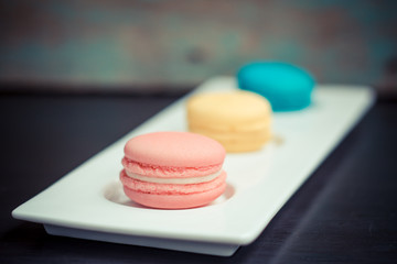 Closeup of three french macaroon cookies