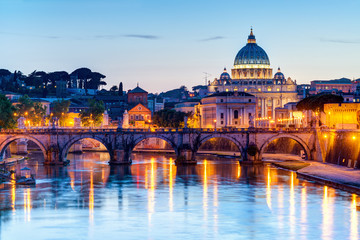Naklejka na ściany i meble Night view of St Peter's cathedral in Vatican City. Rome cityscape at dusk.